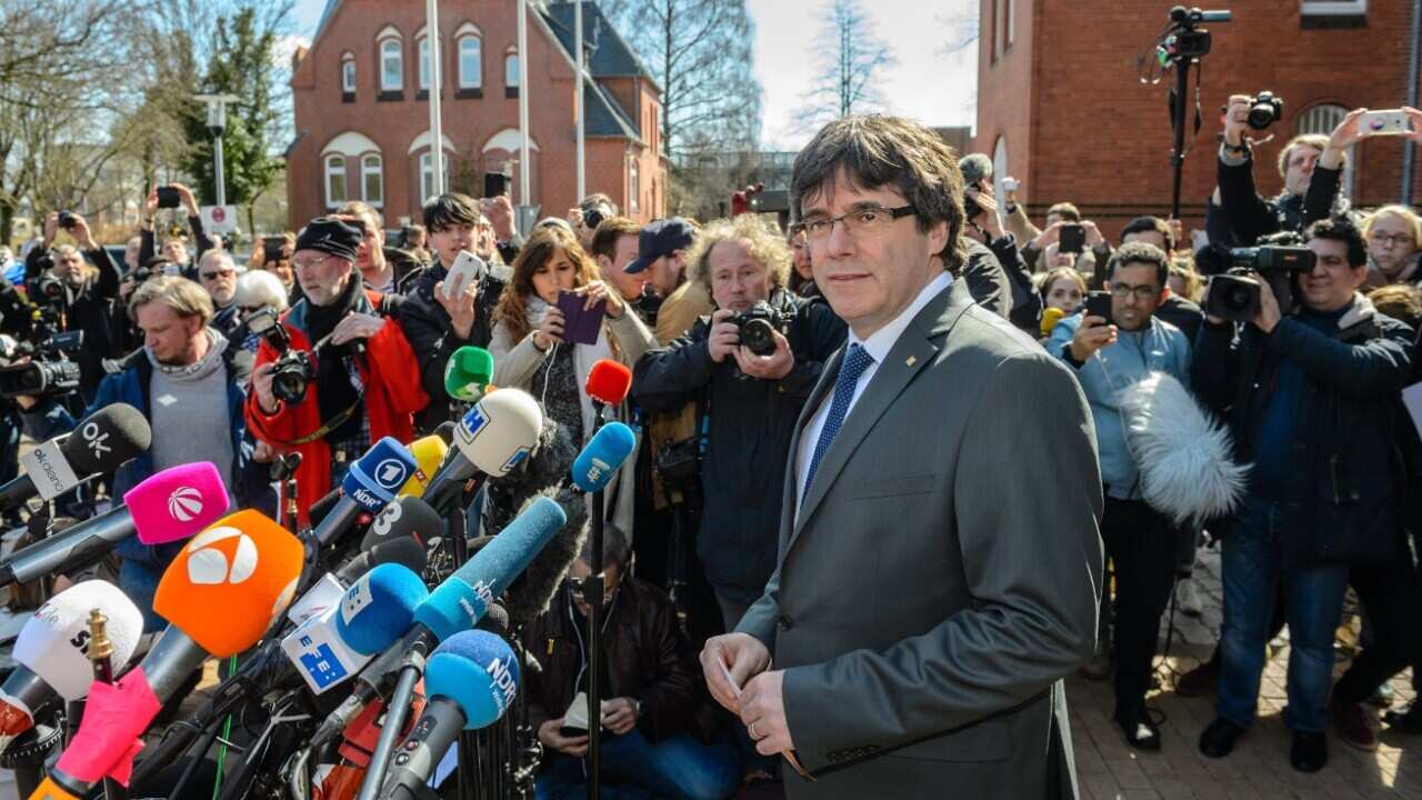 Former Catalan leader Carles Puigdemont gives a press statement after leaving the 'Justizvollzugsanstalt (JVA) Neumuenster' prison 