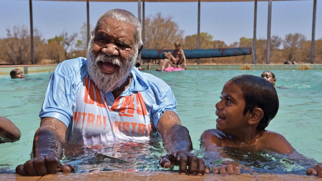 Reggie Uluru and Andre Tucker in the traditional owner-funded Mutitjulu pool.jpg