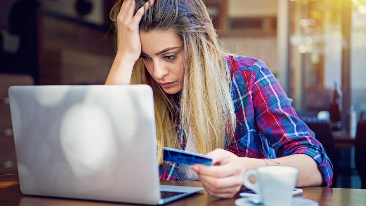 Young girl have problems with her credit card till shopping online