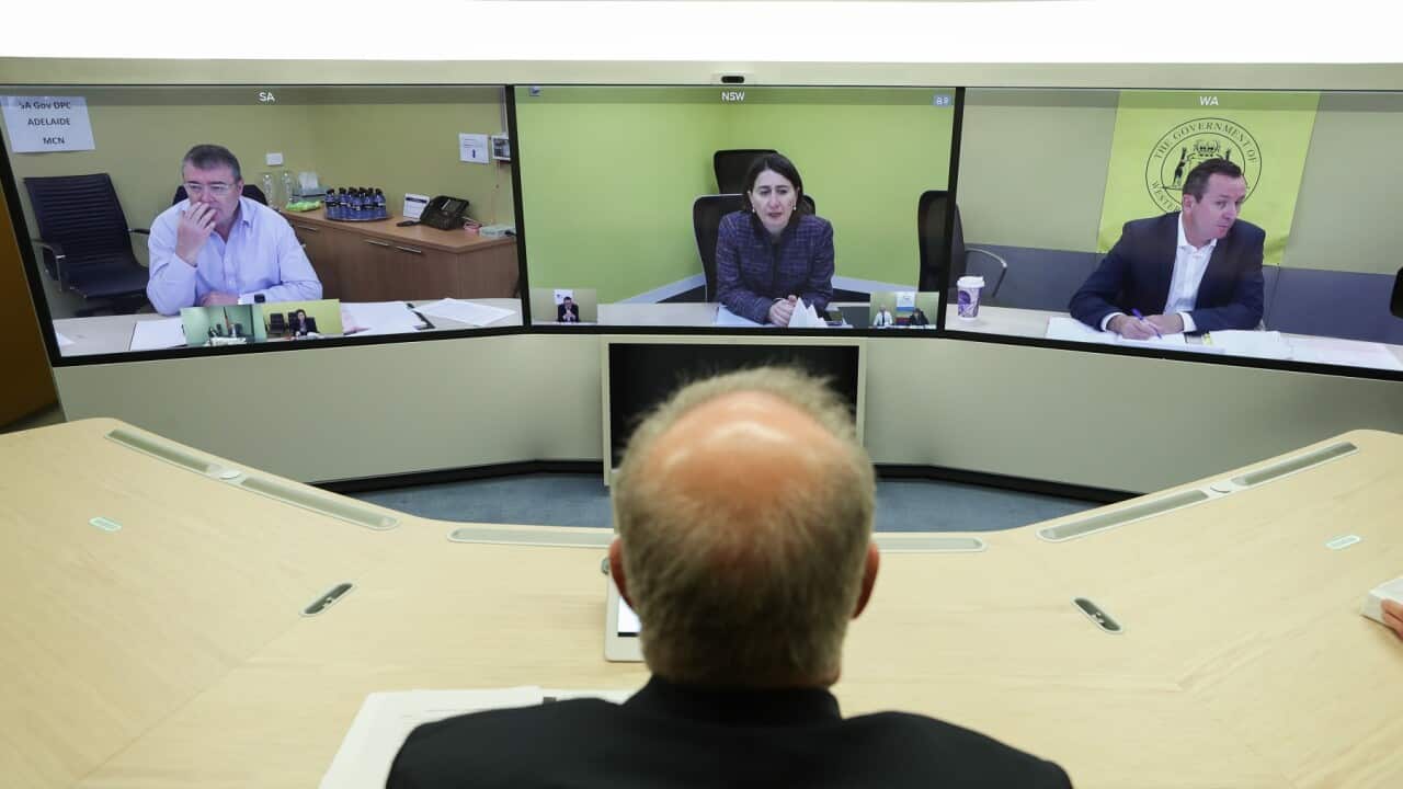 Prime Minister Scott Morrison speaks with (on screen) Jim McDowell, Chief Executive of the South Australia Department of Premier and Cabinet, Premier of NSW Gladys Berejiklian and Premier of Western Australia Mark McGowan during a National Cabinet meeting