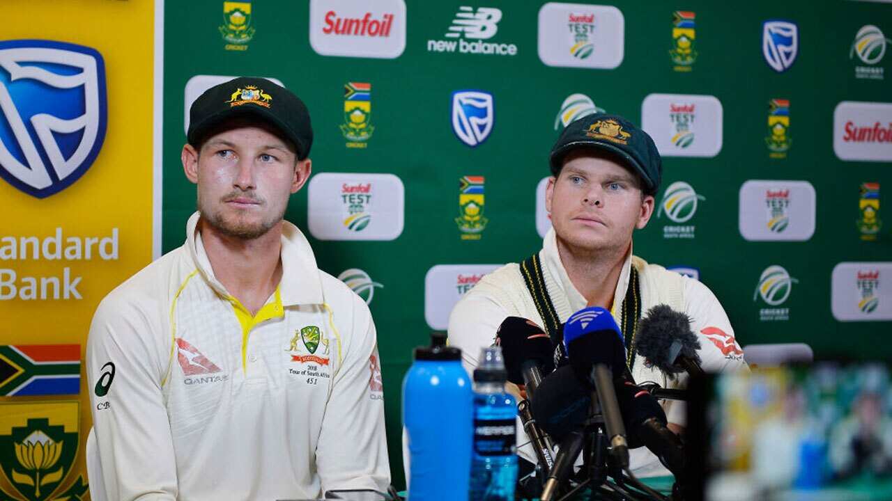 Steven Smith (capt) and Cameron Bancroft (L) of Australia