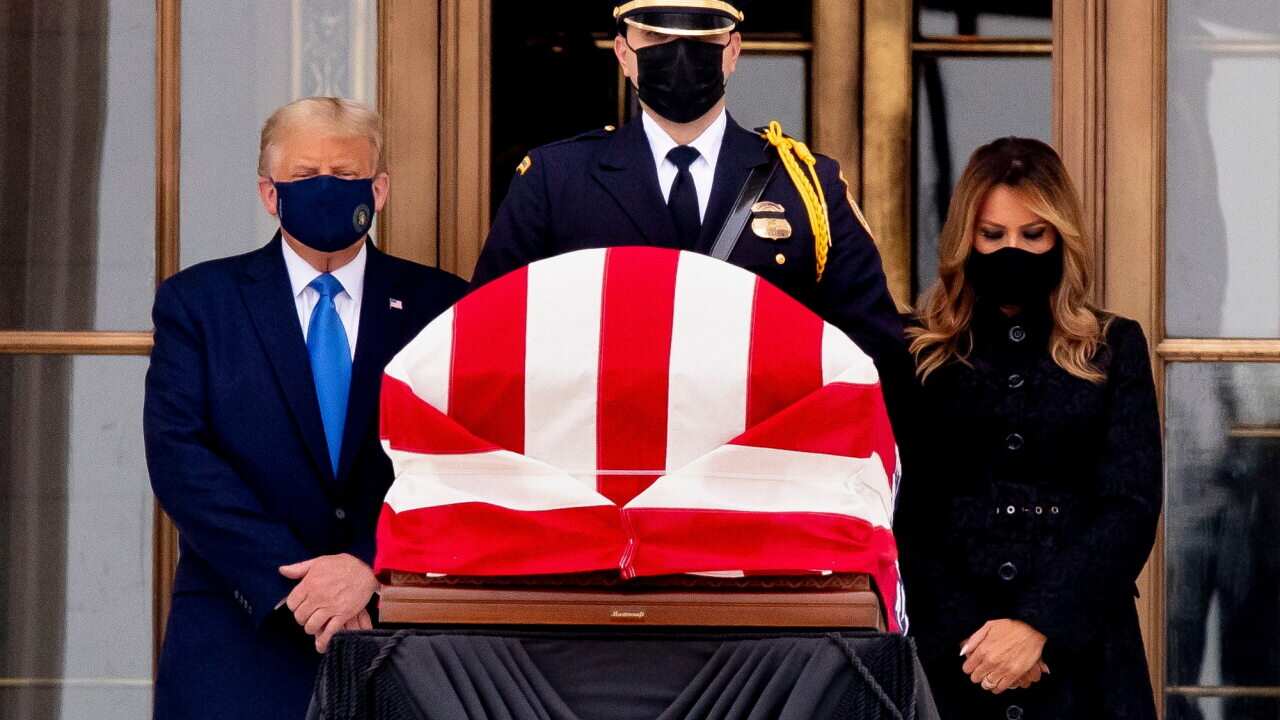 US President Donald Trump and First Lady Melania Trump view the flag-draped casket of late US Supreme Court Justice Ruth Bader Ginsburg in Washington, DC.