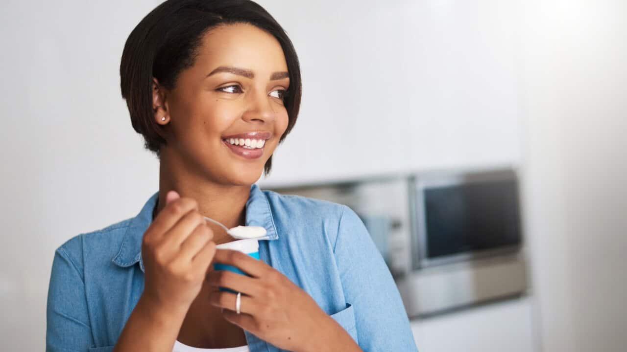 Woman eating yoghurt
