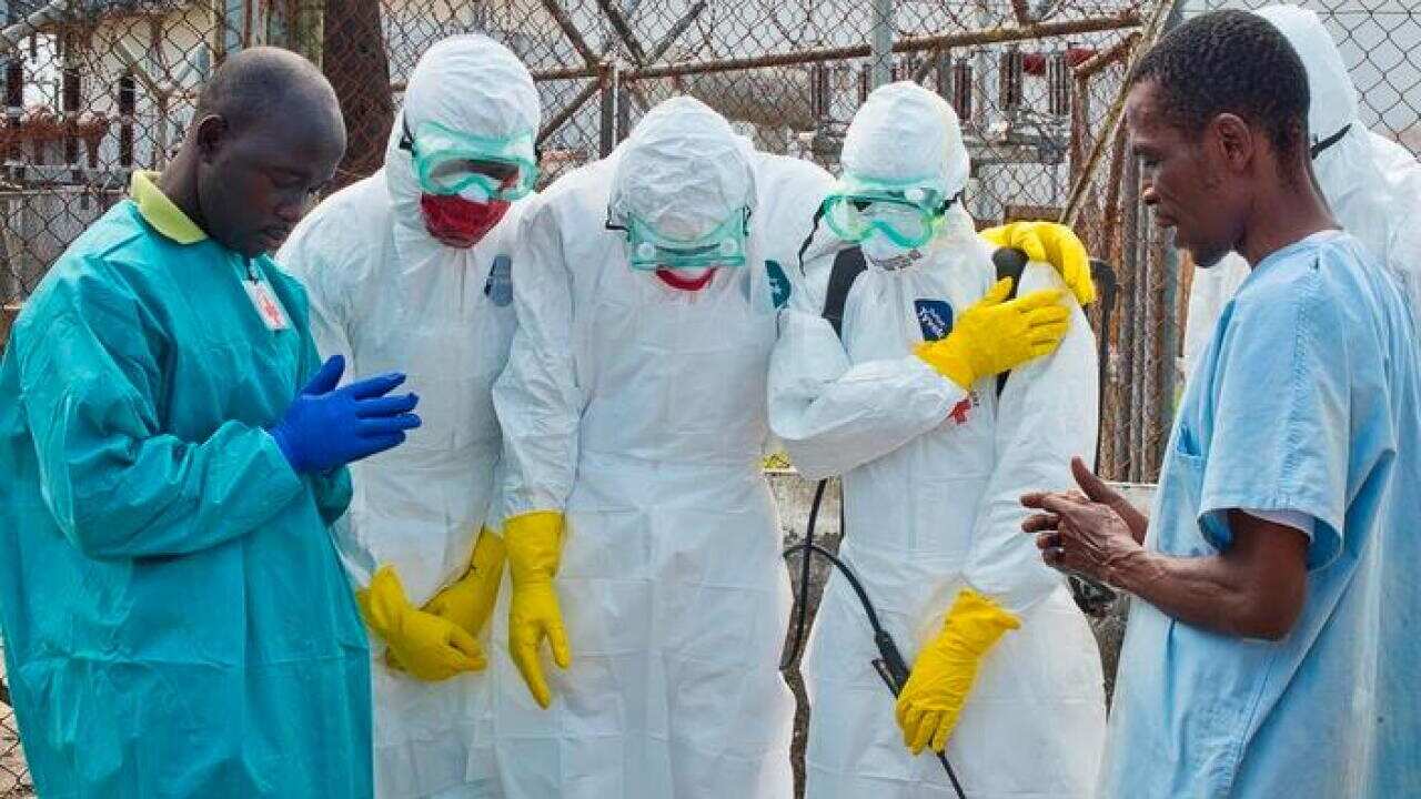 a_prayer_in_liberia_before_removing_a_victims_body_aap_larger.jpg