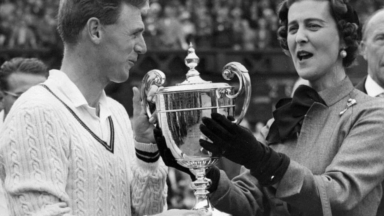 Frank Sedgman presented with the Wimbledon winner's trophy in 1952
