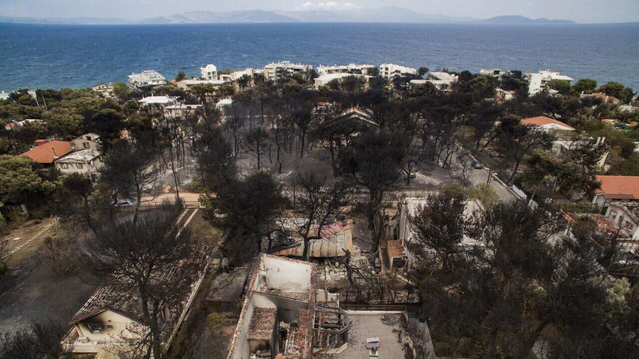 An aerial view shows burnt houses following a wildfire in the village of Mati, near Athens.