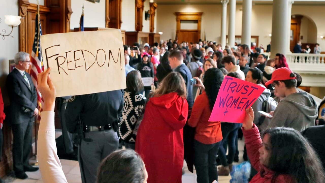 Protesters opposed to a proposed abortion bill fill the hallway on Monday, March 18, 2019, in Atlanta.