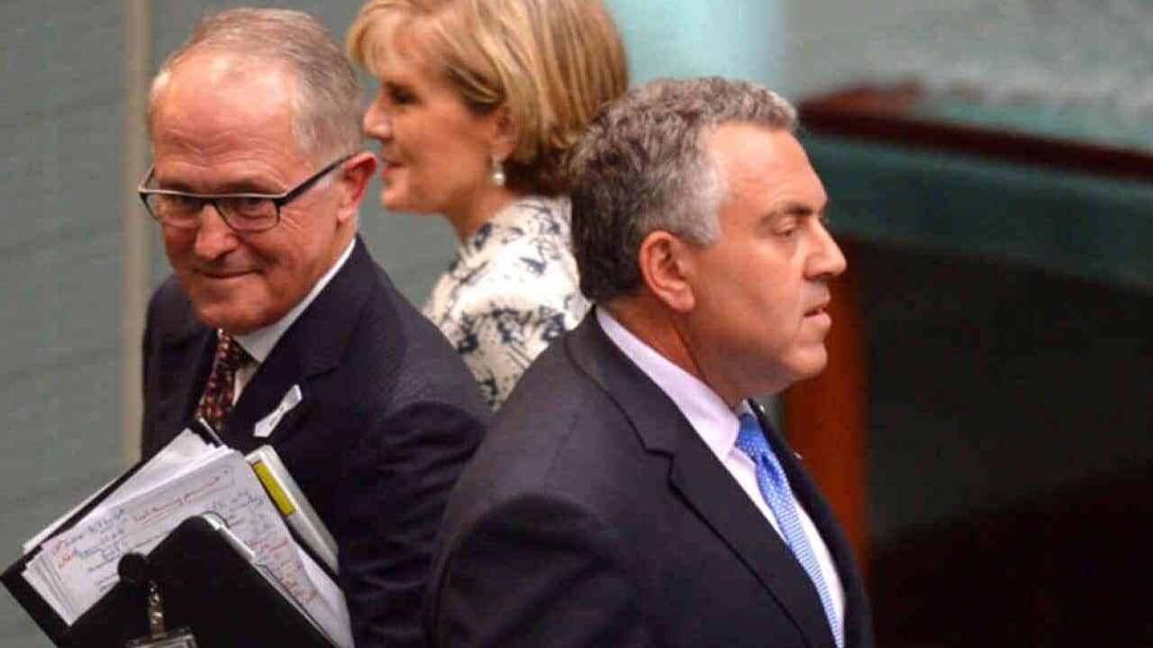 Communications minister Malcolm Turnbull, foreign minister Julie Bishop and federal treasurer Joe Hockey leave after question time in the house of representatives, Parliament House, Canberra, Tuesday, Nov. 25, 2014. (AAP Image/Alan Porritt) NO ARCHIVING