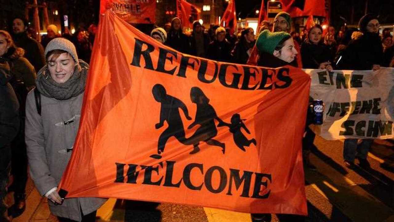 People demonstrate against the result of a national referendum on immigration in Zurich, Switzerland
