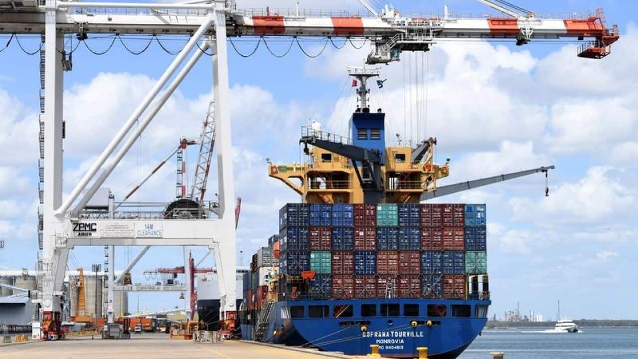 A container ship is docked at the Port of Brisbane.