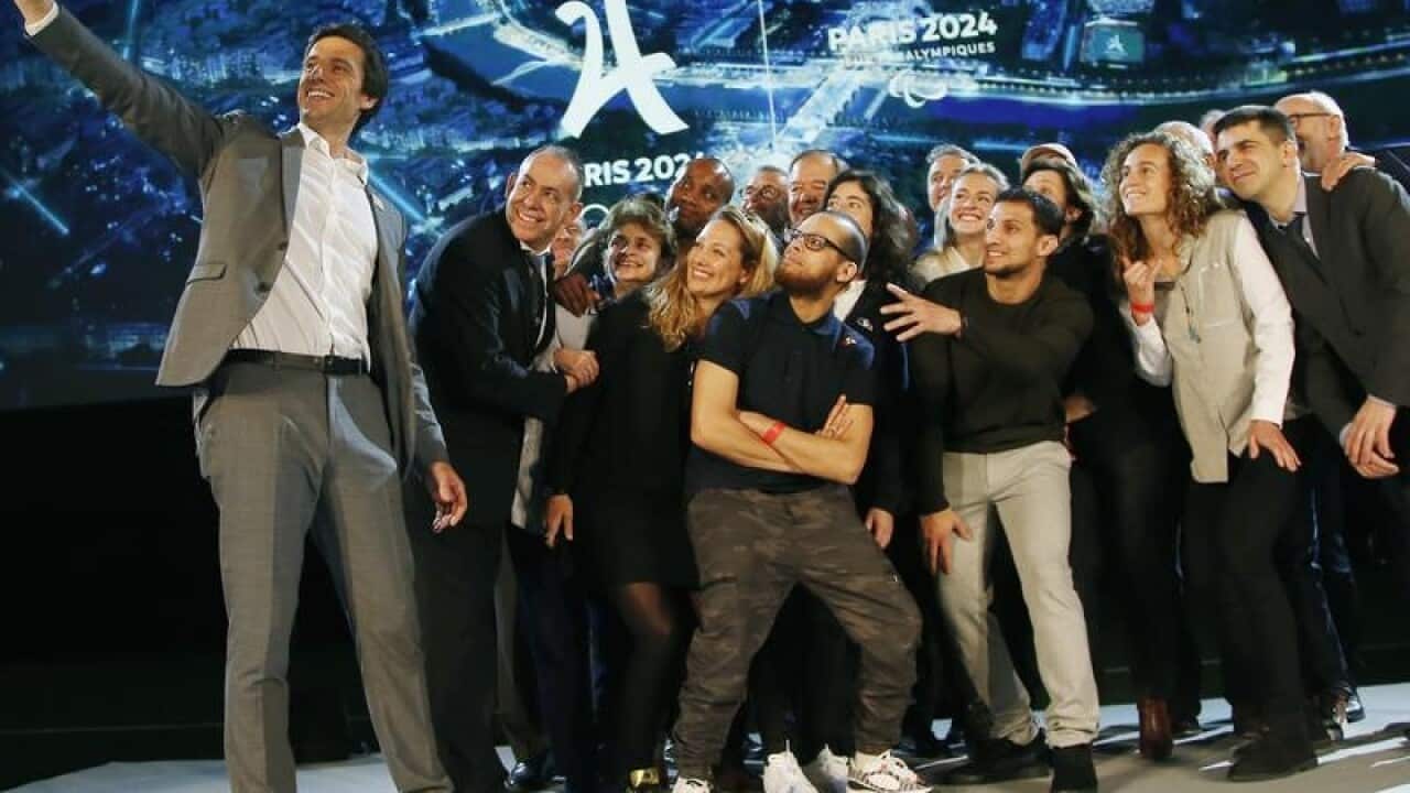 Paris 2024 Olympic Games chief Tony Estanguet (L)