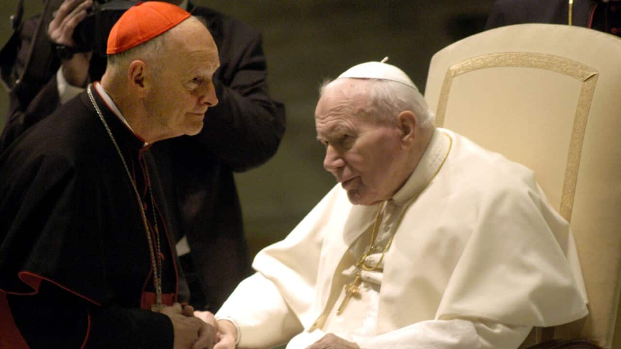 Pope John Paul II greets Washington's Archbishop Cardinal Theodore Edgar McCarrick at the Pope's weekly general audience January 15, 2003 in Vatican City, Rome.