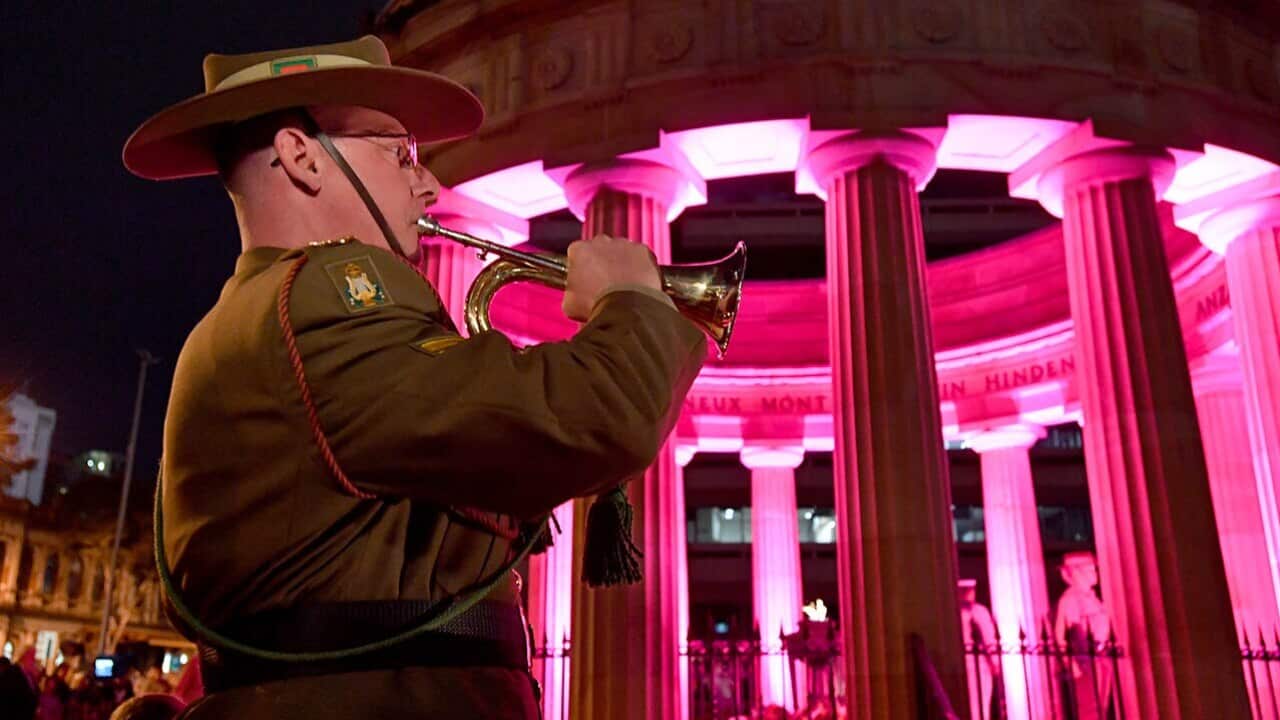 An Australian Army bugler plays the Last Post during the Anzac Day dawn service at the Shrine of Remembrance in Anzac Square in Brisbane.