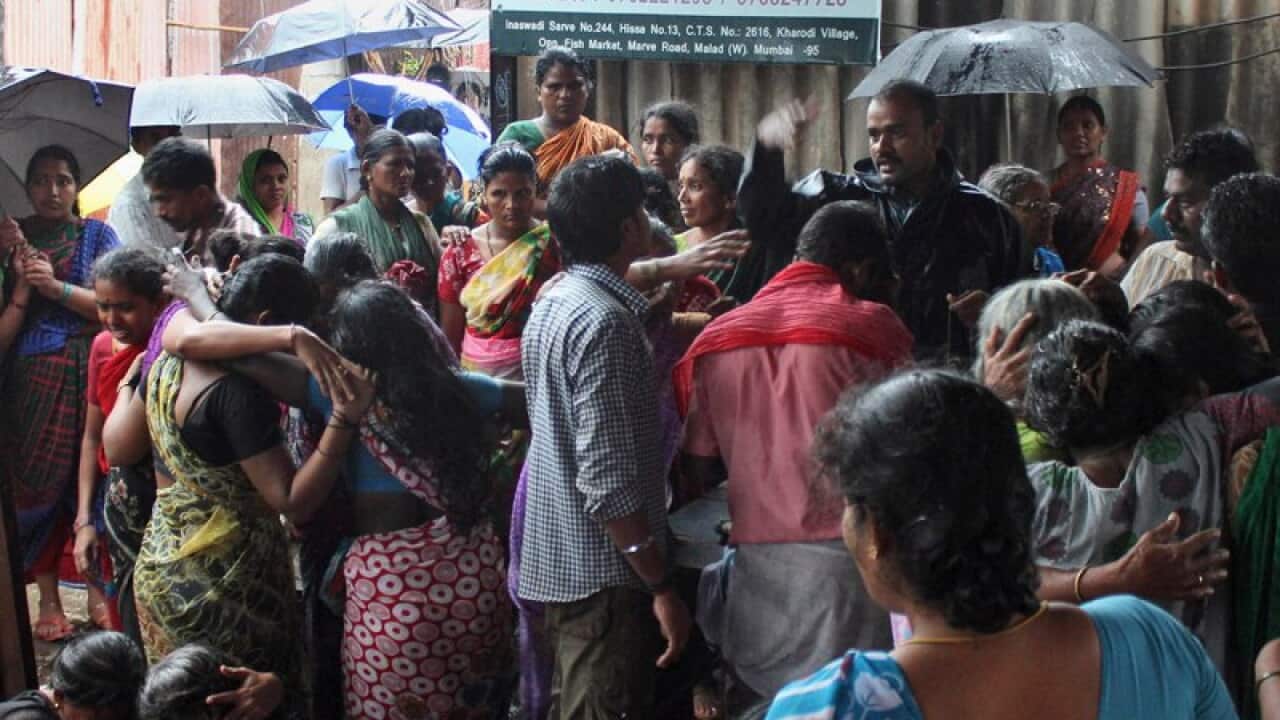 Family members of people who died after drinking tainted liquor wail