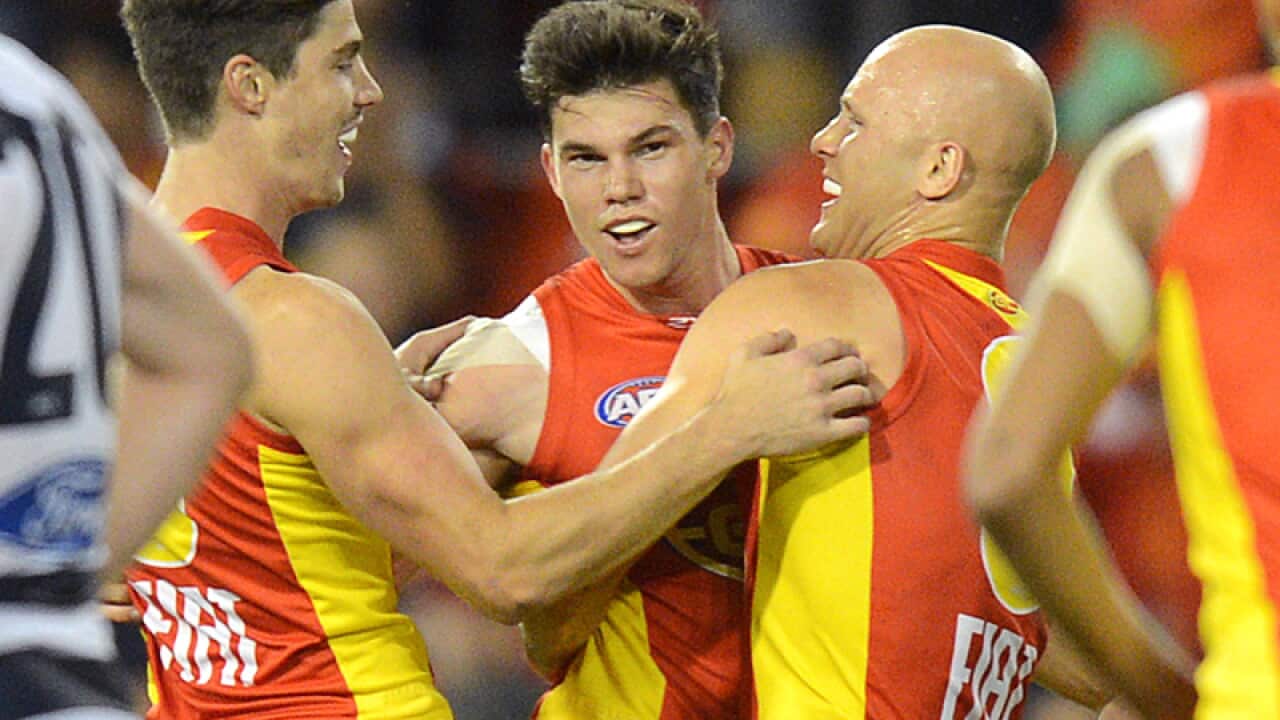 Suns players reacts with goal scorer Jaeger O'Meara