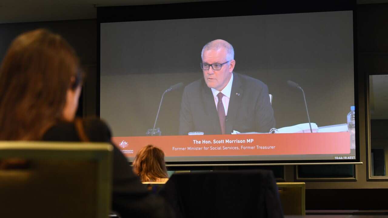 Former prime minister Scott Morrison is seen on a screen in the media room at the first hearing block of the Royal Commission into the Robodebt Scheme at the Pullman Brisbane King George Square Hotel in Brisbane, Wednesday, December 14, 2022