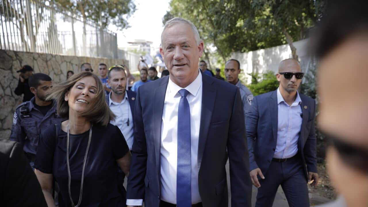 Blue and White party leader Benny Gantz and his wife Revital leave polling station in Rosh Haayin, Israel, Tuesday, Sept. 17, 2019.