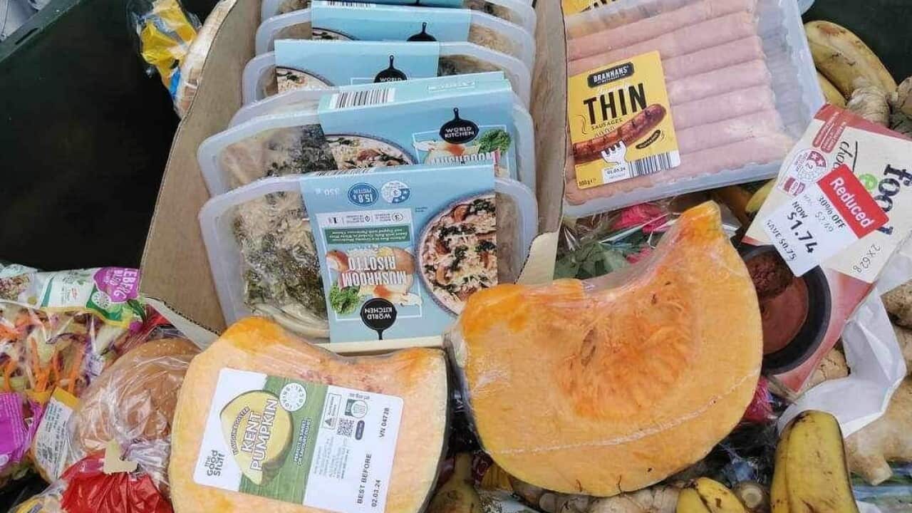 Close up shot of pumpkins, sausages, bananas, coleslaw, burger buns and other food items all in their packages