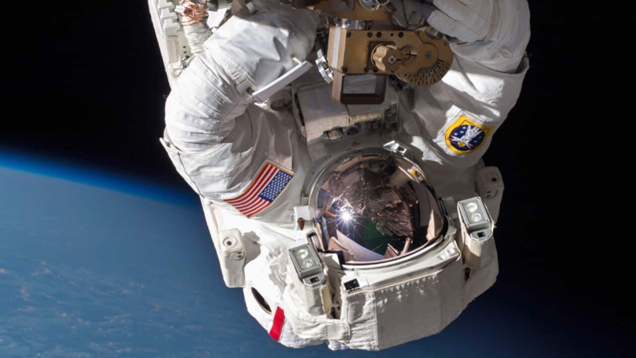 Astronaut Chris Cassidy performs a space walk