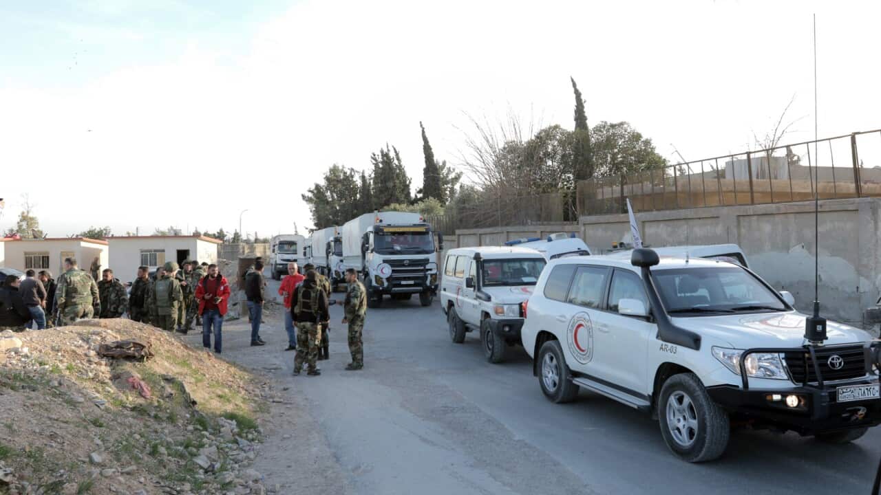 United Nations vehicles drive out of Eastern Ghouta in the countryside of Damascus.