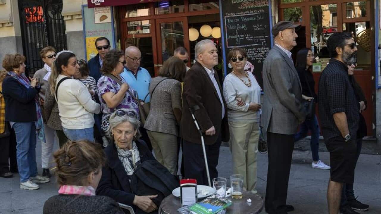 People line up to vote in Spain's general election