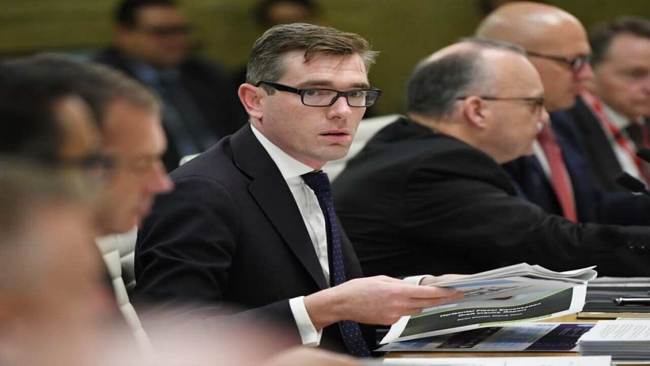 NSW Treasurer Dominic Perrottet is seen during a meeting.