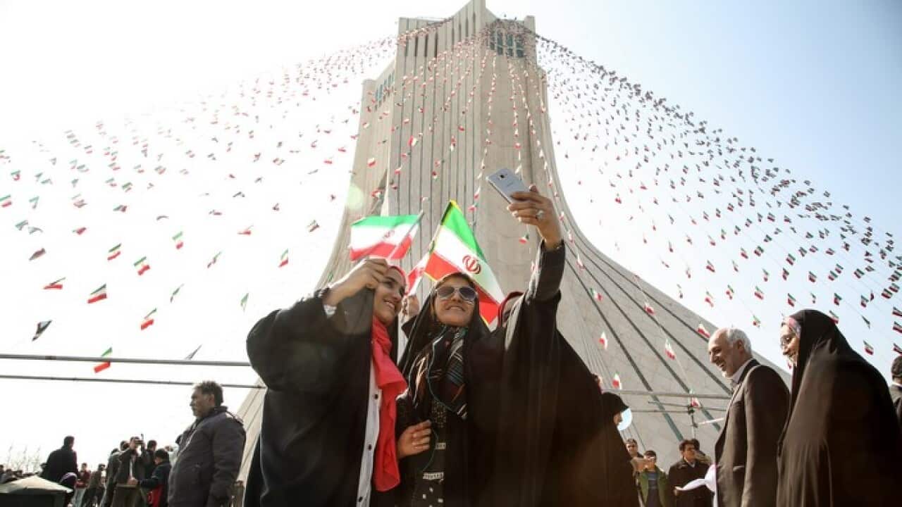 Women take a selfie during a ceremony marking the 39th anniversary of the Islamic revolution, at Azadi Square in Tehran, Iran on February 11, 2018.
