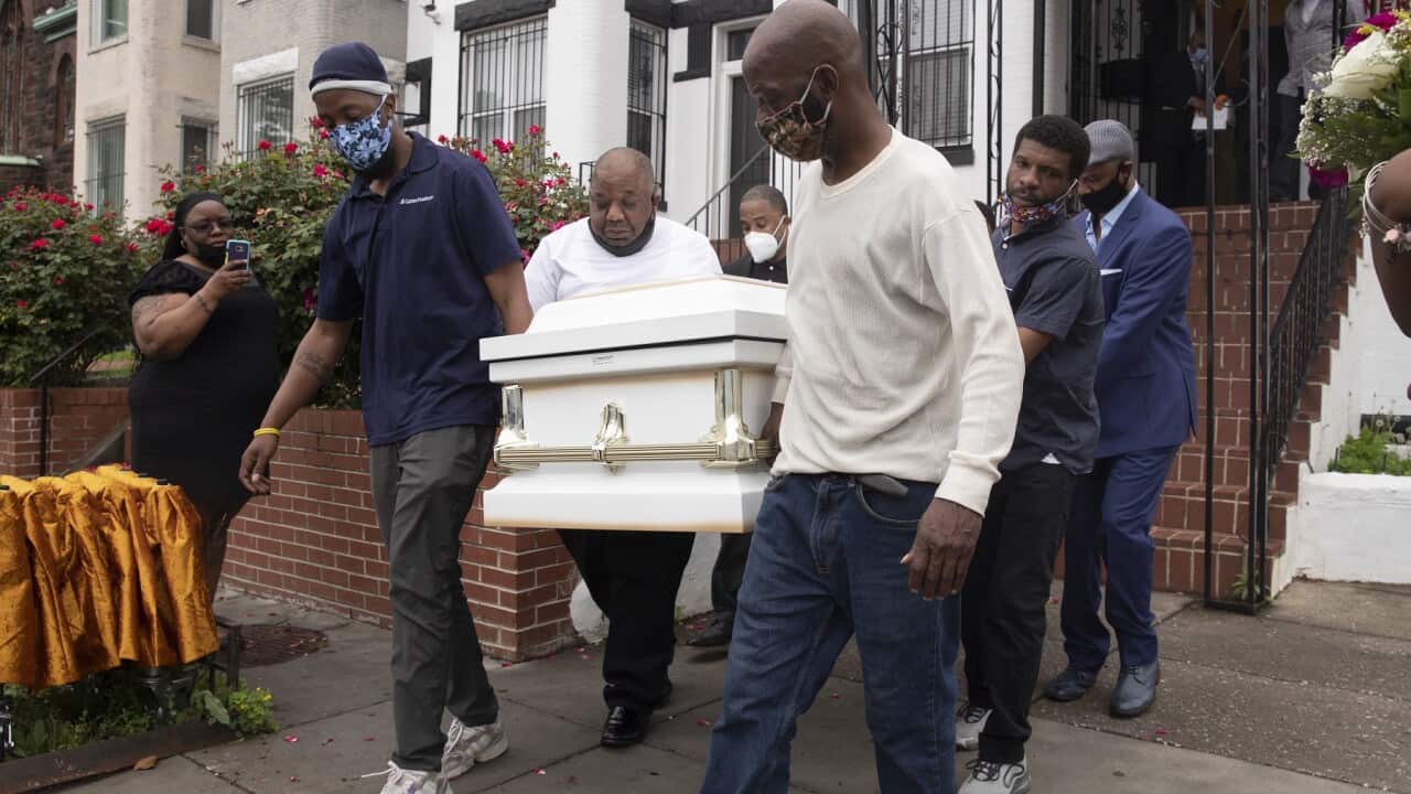 Pallbearers carry the casket of Evelyn Moore Smith, who died with coronavirus in Washington DC