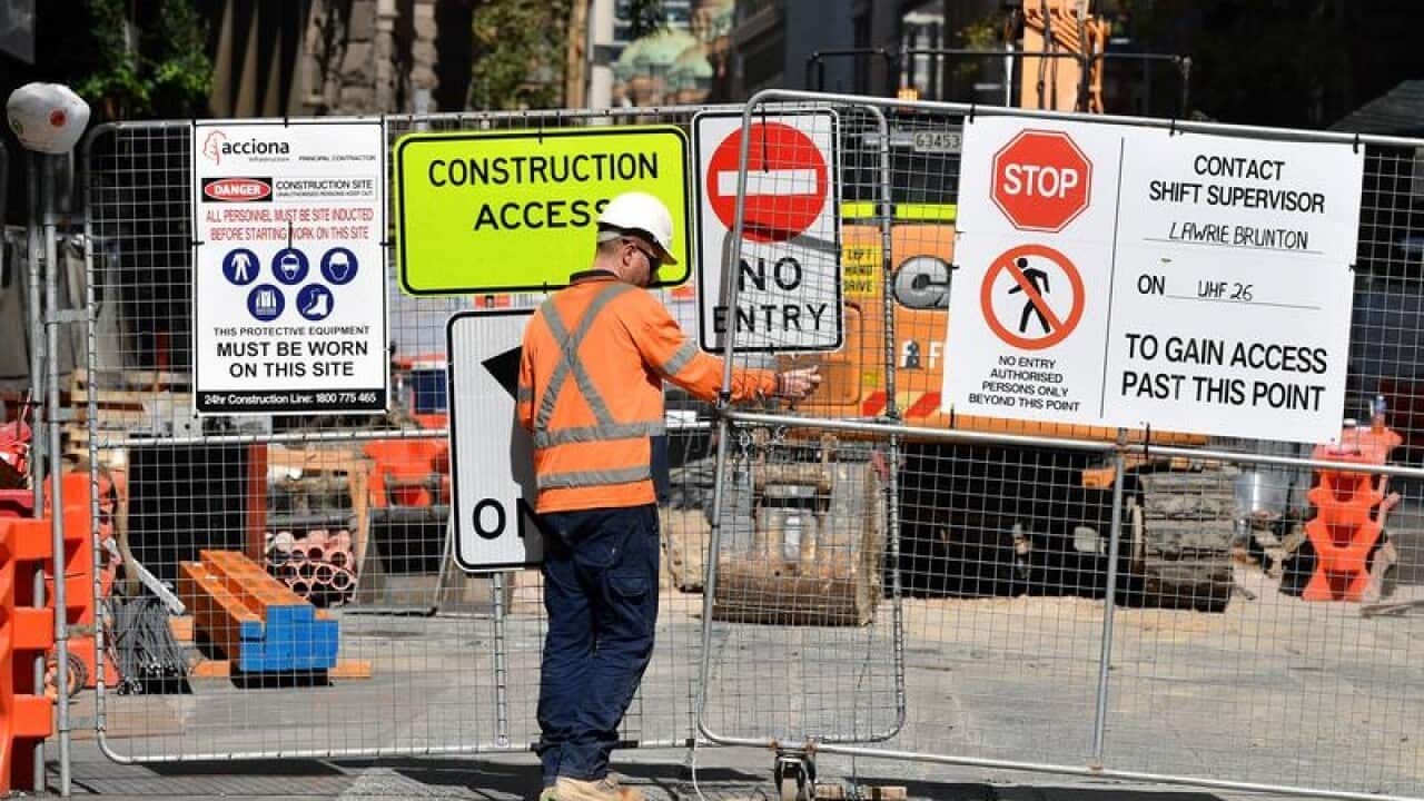Signage for Sydney light rail contractor Acciona seen at a worksite