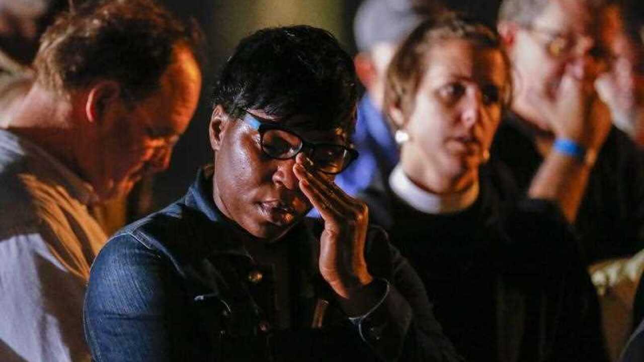 Anti death penalty protesters react outside the Georgia Diagnostic Prison after learning of the execution by lethal injection of Kelly Gissendaner