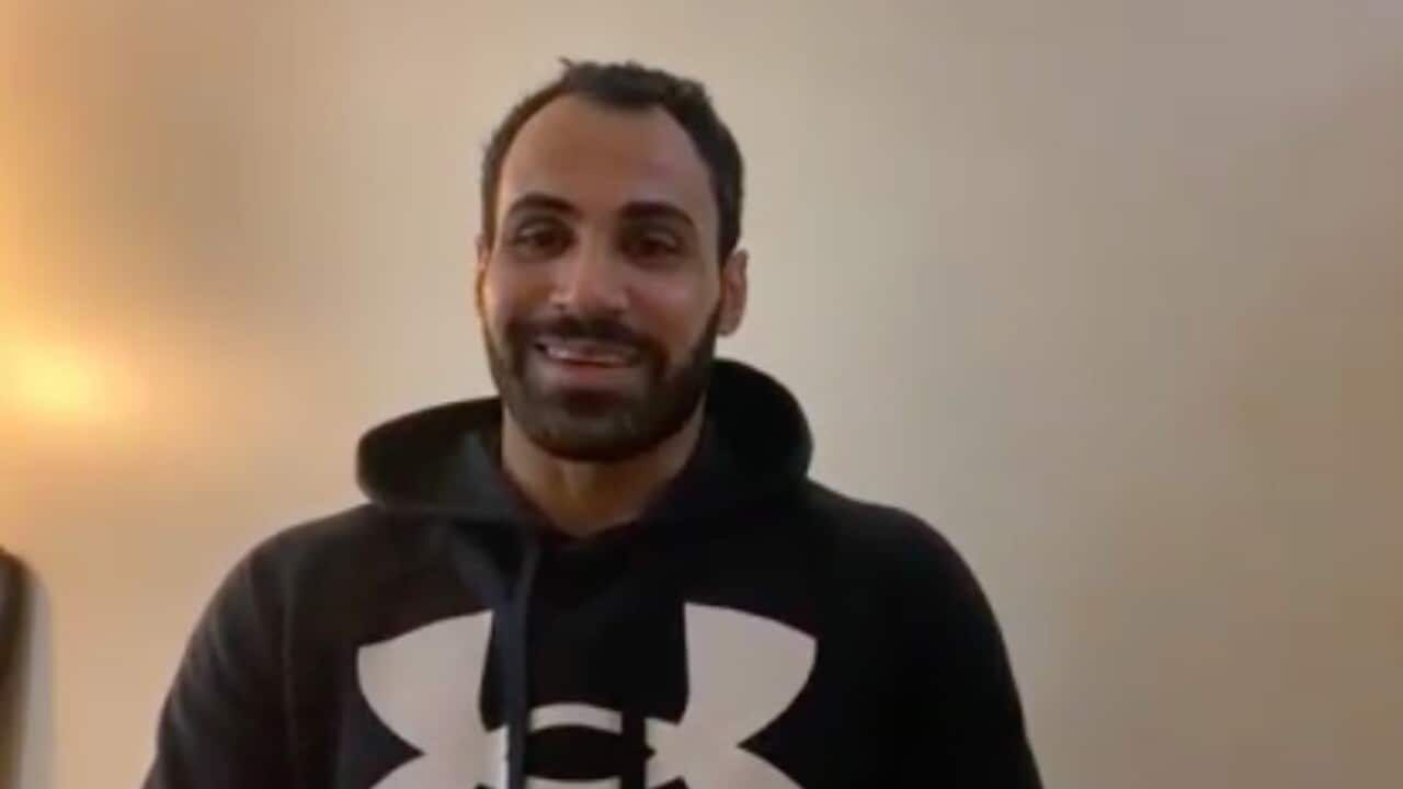 Hossein Latifi speaking from a motel in Melbourne after his release from the Park Hotel.