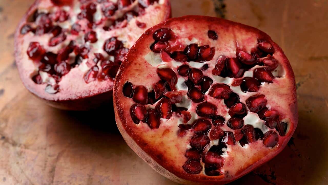The cases have been linked to imported frozen pomegranate products.