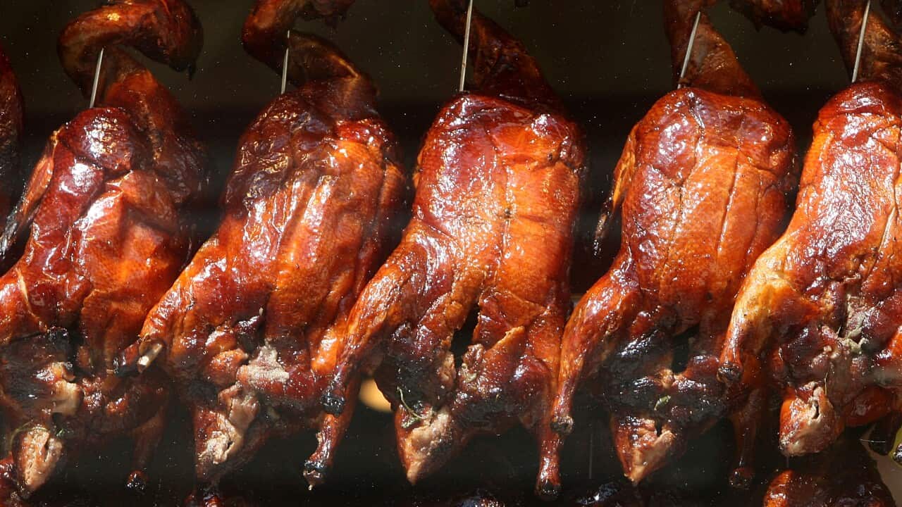 Cooked ducks hang in the window of a Chinese restaurant in Chinatown on July 21, 2008 in London, England. (Cate Gillon/Getty)