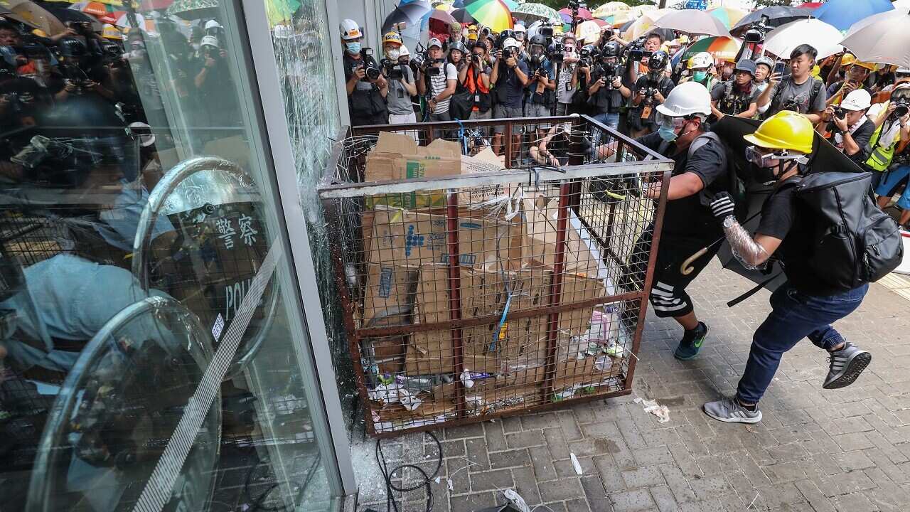 Protesters smash window of the Legislative Council in Hong Kong.