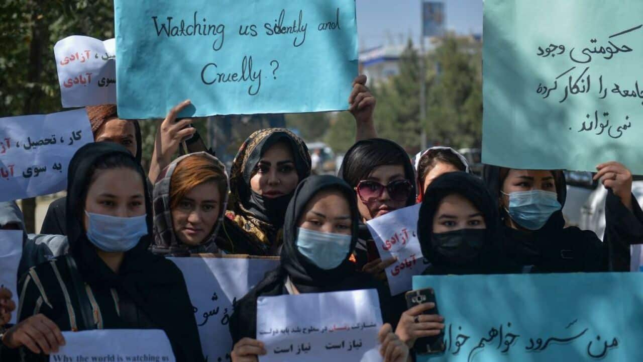 Afghan women hold banners and placards as they take part in an anti-Pakistan protest in Kabul on September 8, 2021.