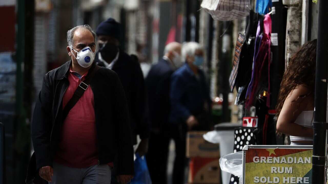 Customers stroll through Shepherd's Bush market in London.