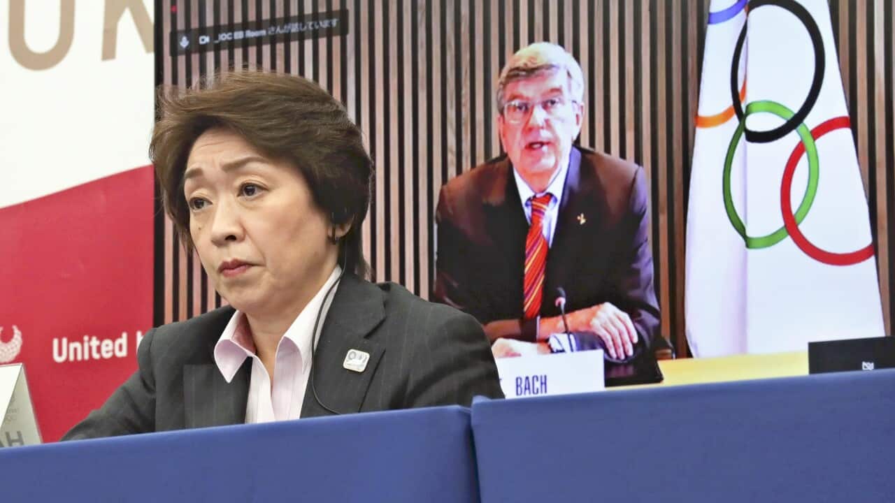 Tokyo Games organizing committee President Seiko Hashimoto (front) attends a five-party meeting with International Olympic Committee President Thomas Bach and others in Tokyo on March 3, 2021.