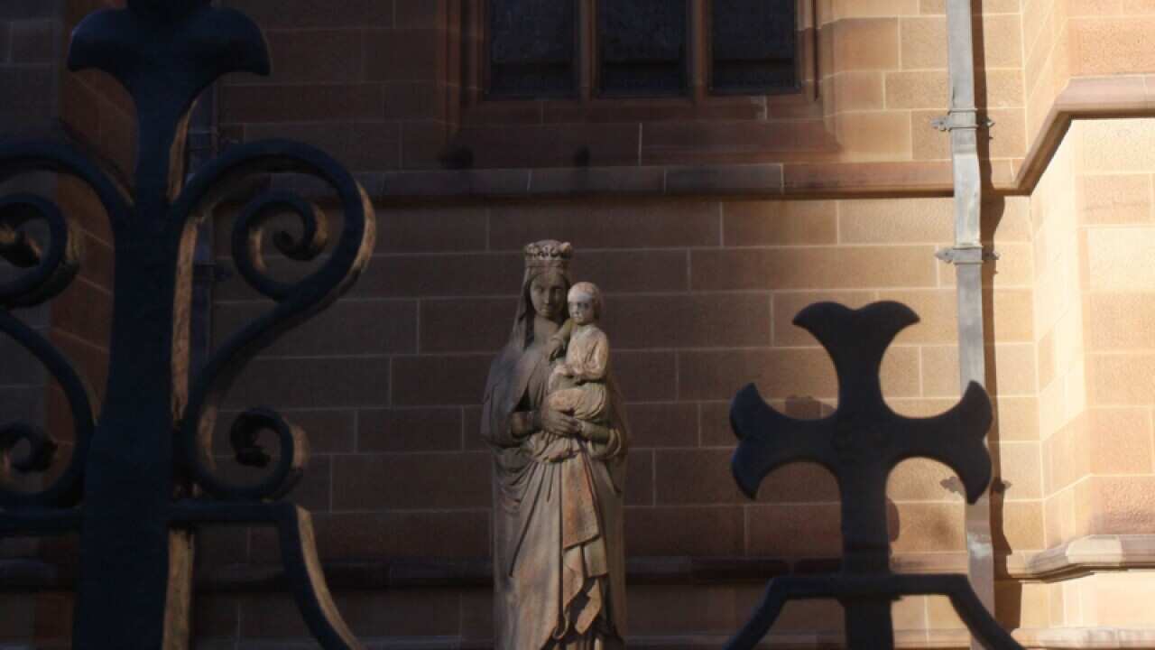 A statue outside St Mary's Cathedral in Sydney