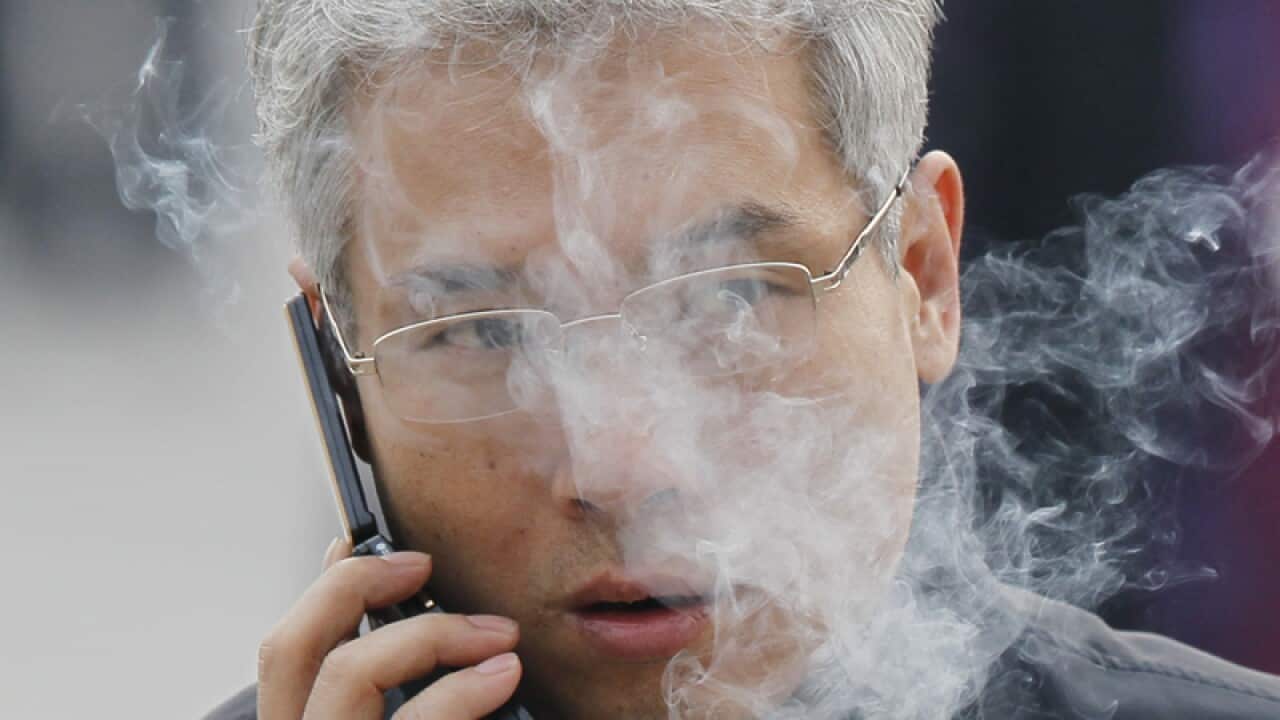 A man smokes