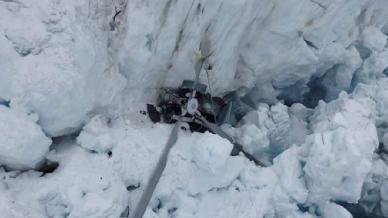 The wreckage of a helicopter on the Fox Glacier.