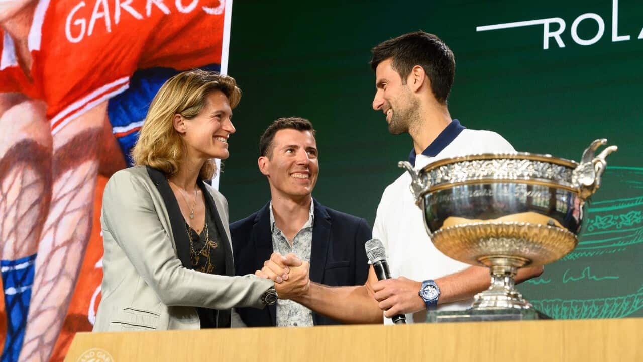 (Left to right) Amelie Mauresmo, Quentin Fillon Maillet and Novak Djokovic attend the French tennis international draw at Roland Garros, Paris on 19 May 2022.