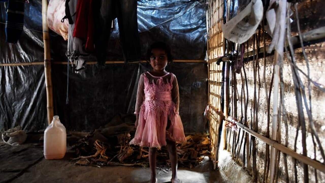 Child Rohingya refugee Dillnewaz in her shack at a refugee camp.