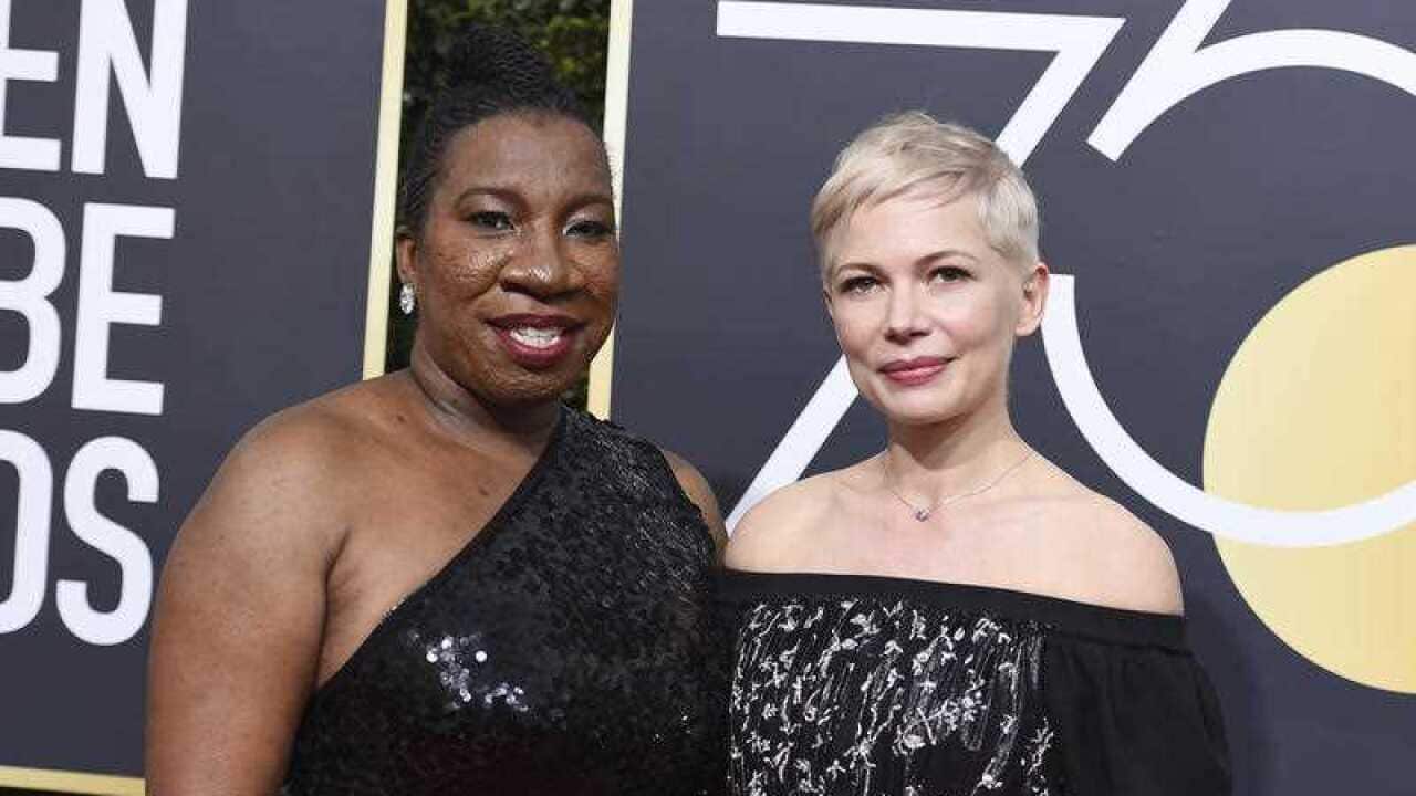 Tarana Burke, left, and Michelle Williams arrive at the 75th annual Golden Globe Awards at the Beverly Hilton Hotel on Sunday, Jan. 7, 2018, in Beverly Hills.