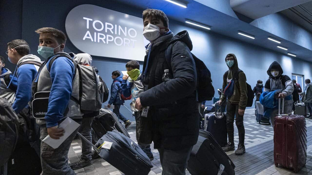 People wearing masks arriving to Sandro Pertini Airport on 28 February, 2020, in Turin Italy.