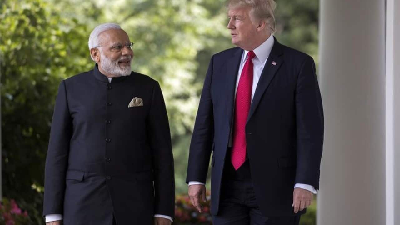 US President Donald Trump (R) and Indian PM Narendra Modi (L)