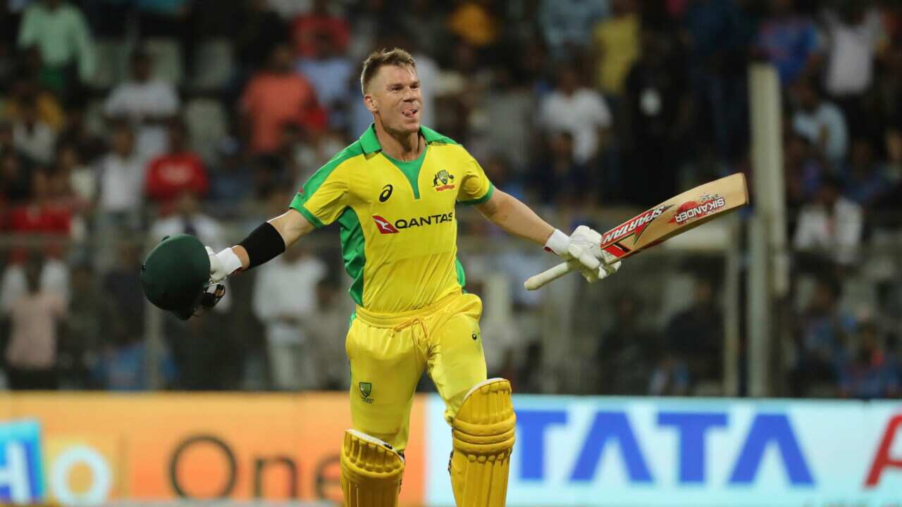 Australia's David Warner celebrates after scoring a hundred during the first one-day international cricket match between India and Australia in Mumbai, India, Tuesday, Jan. 14, 2020. (AP Photo/Rafiq Maqbool)