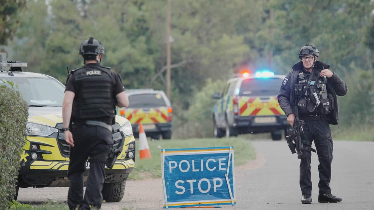 Police at a road block on the road to RAF Fairford after major incident has been declared, with armed police manning a cordon near the village of Whelford in Gloucestershire, near RAF Fairford which is used by the United States Air Force (USAF).