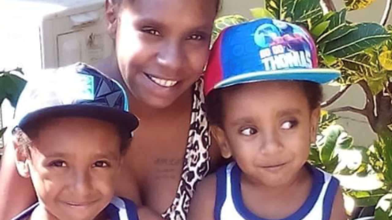 Charlie Gowa, his mum Xernona and his little brother.