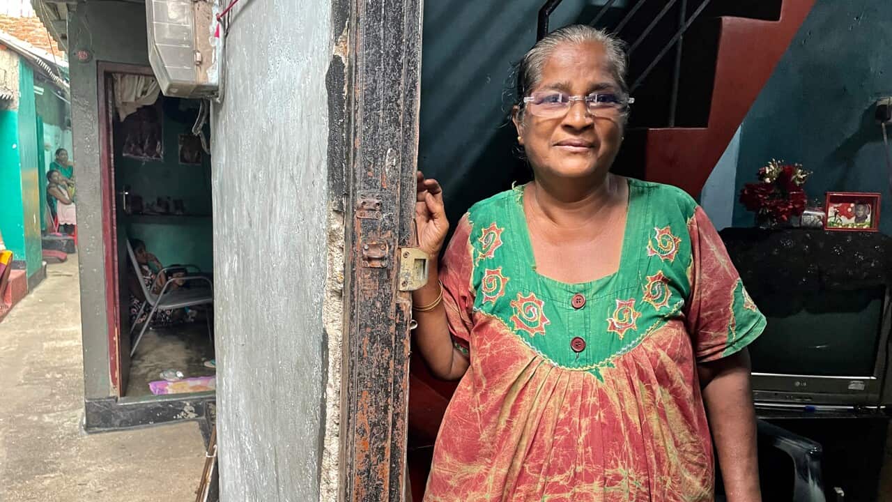 Soosai Melbin Amma stands outside