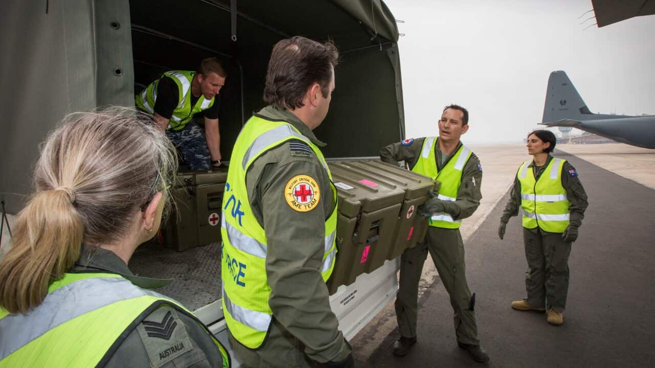 Number 3 Aeromedical Evacuation Squadron personnel preparing medical equipment to load onto a C-130J Hercules ahead of the flight to New Zealand.